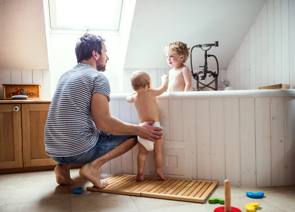 A father and children in the bathtub