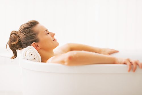 A woman relaxing in a bathtub 